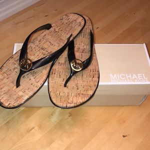 Michael Koors Black patent flip flops